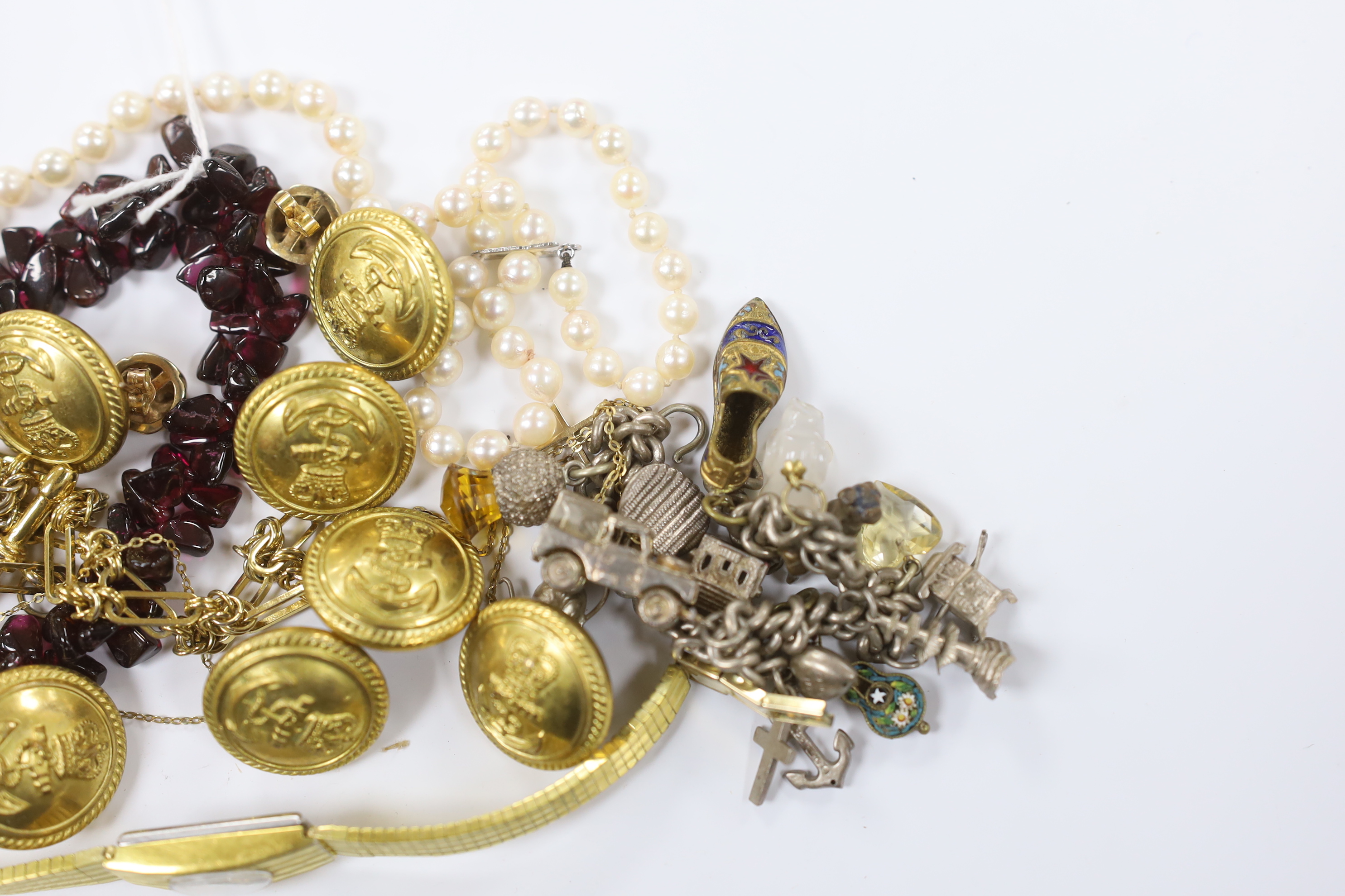 A single strand garnet pebble necklace, with barrel clasp, 38cm, eight military buttons, a lady's steel and gold plated Rotary wrist watch, a pair of 9ct knot ear studs, a yellow metal cross pendant on a 750 chain, a whi